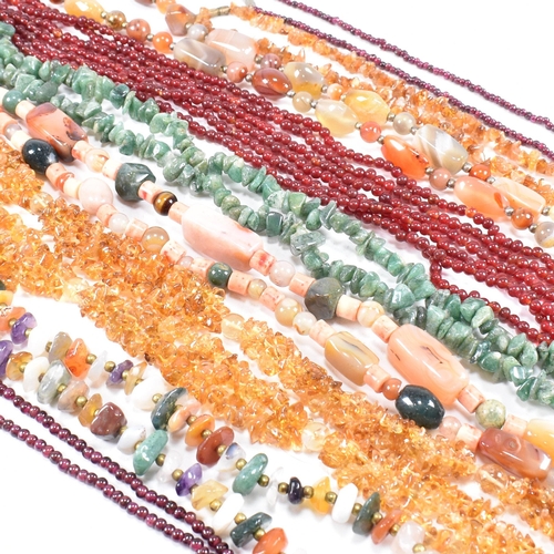 255 - An assortment of vintage bead necklaces. The necklaces to include agate, garnet, amethyst, citrine, ... 