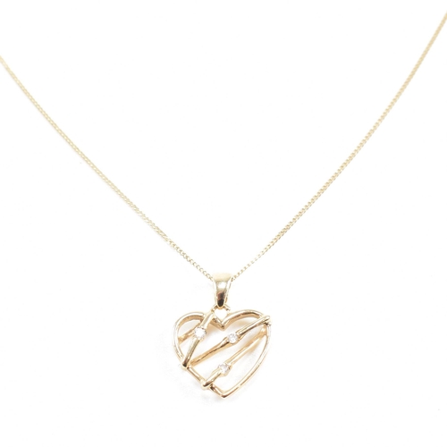 256 - A 9ct gold chain necklace strung with a hallmarked gem set heart pendant. Weight 1.8g. Measures chai... 