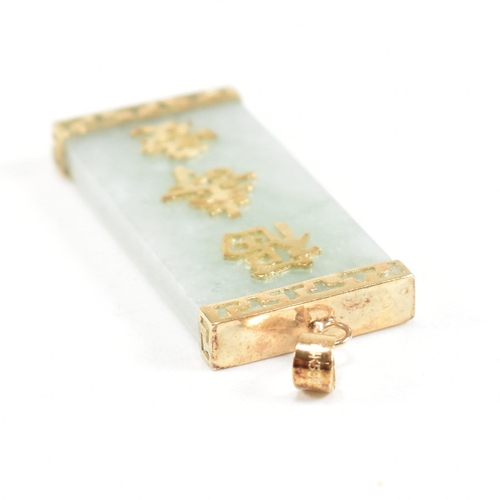 258 - A 14ct gold mounted jade pendant. The pendant having Chinese script - happiness, longevity and love ... 