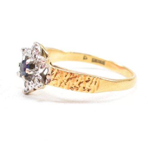 26 - A hallmarked 18ct gold sapphire cluster ring. The ring hallmarked London. Weight 3.5g. Size N. All w... 