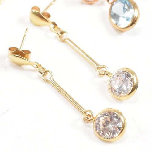 261 - Three pairs of 9ct gold gem set pendant earrings. The earrings set with CZ, crystal, and topaz. Tota... 