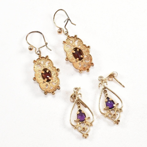 262 - A pair of hallmarked 9ct gold pendant earrings. A pair of earrings set with an oval cut garnet and a... 