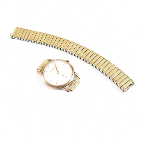 264 - A 9ct gold Accurist 21 jewels  anti magnetic gentleman's wristwatch. The champagne dial with baton n... 