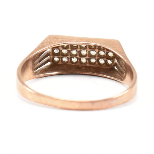 269 - A hallmarked 9ct gold pave set ring. The ring set with 21 white stones being pave set to plain taper... 