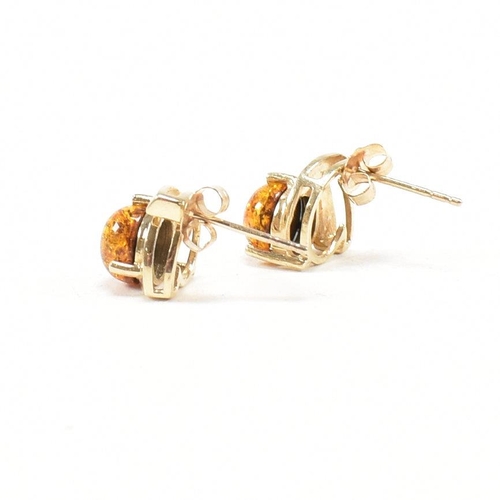 272 - 9ct gold and amber earrings and a tanzanite pendant. The earrings hallmarked for Birmingham. Measure... 