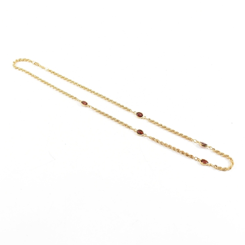 274 - A hallmarked 9ct gold and garnet rope twist chain necklace. Weight 4.5g. Measures 44cm. All weights,... 