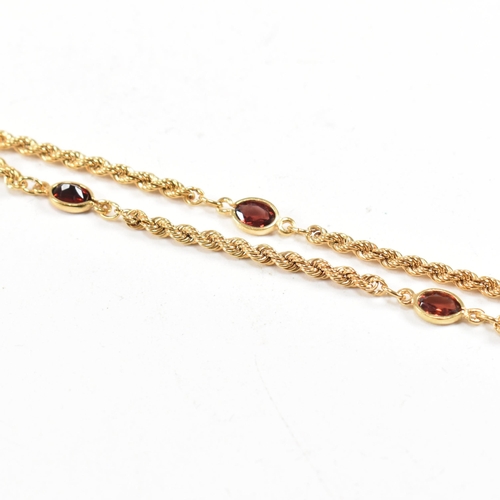 274 - A hallmarked 9ct gold and garnet rope twist chain necklace. Weight 4.5g. Measures 44cm. All weights,... 