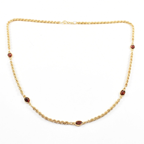 274 - A hallmarked 9ct gold and garnet rope twist chain necklace. Weight 4.5g. Measures 44cm. All weights,... 