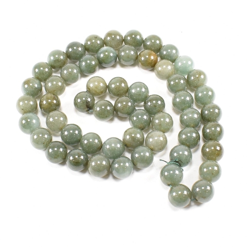 279 - A vintage nephrite bead necklace. Measures 72cm. Beads approx 10mm each. All weights, measurements a... 