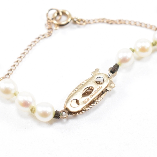 28 - A hallmarked 9ct gold and cultured pearl necklace and an early 20th century diamond set 9ct gold but... 