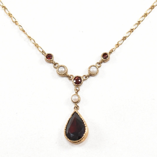 285 - A hallmarked 9ct gold garnet and pearl pendant necklace.  Weight 2.7g. Measures 40cm plus pendant 2.... 