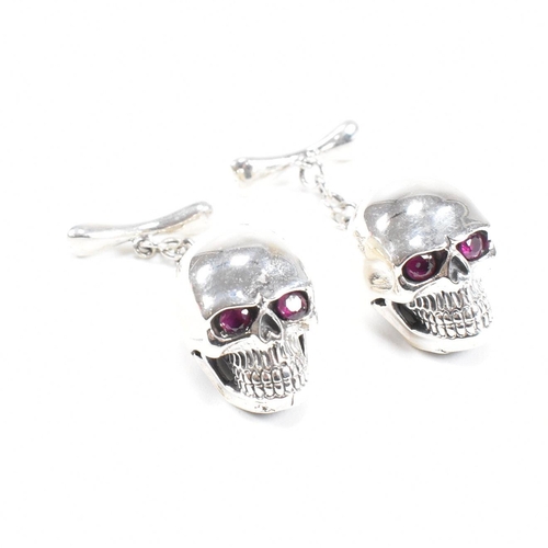 289 - A contemporary pair of 925 silver skull novelty cufflinks. Stamped 925. Weight approx 12.9g. Measure... 