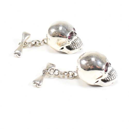 289 - A contemporary pair of 925 silver skull novelty cufflinks. Stamped 925. Weight approx 12.9g. Measure... 