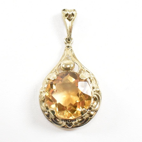 295 - A 333 gold and citrine necklace pendant. Weight 2.3g. Measures 3cm. All weights, measurements and si... 