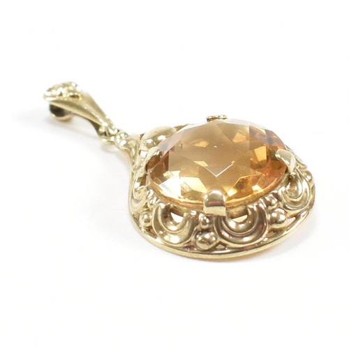 295 - A 333 gold and citrine necklace pendant. Weight 2.3g. Measures 3cm. All weights, measurements and si... 