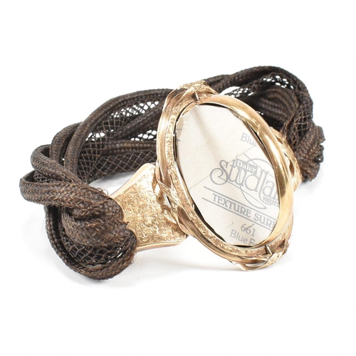 3 - A 19th century Victorian mourning memento mori braided hairwork locket bracelet. The rolled gold loc... 