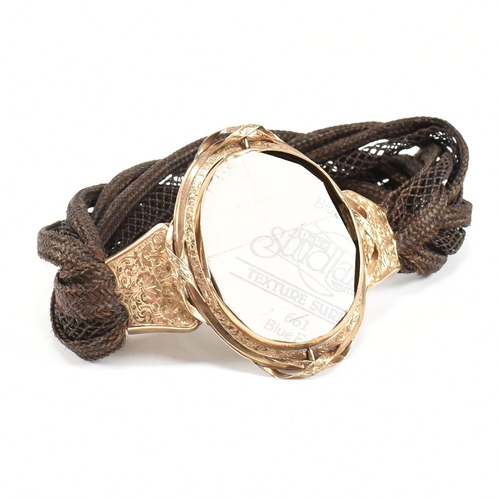 3 - A 19th century Victorian mourning memento mori braided hairwork locket bracelet. The rolled gold loc... 