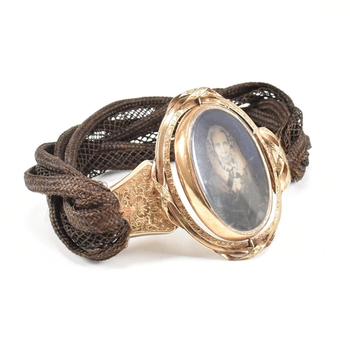 3 - A 19th century Victorian mourning memento mori braided hairwork locket bracelet. The rolled gold loc... 