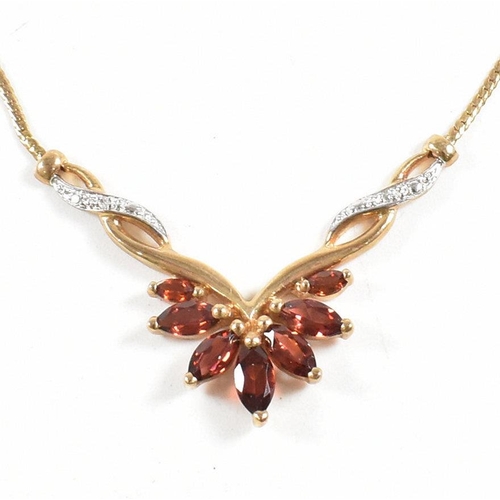 313 - A hallmarked 9ct gold garnet and diamond pendant necklace. Weight 5g. Measures 42cm.Cased. All weigh... 