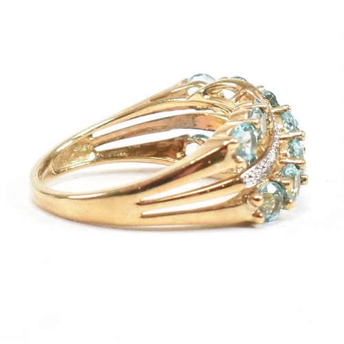 32 - A hallmarked 9ct gold aquamarine and diamond crossover ring. Weight 3.4g. Size O. All weights, measu... 