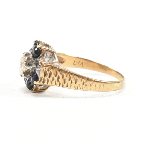 324 - A hallmarked 9ct gold sapphire and diamond cluster ring. The ring having one stone missing. Hallmark... 