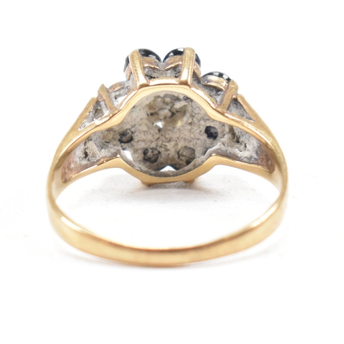 324 - A hallmarked 9ct gold sapphire and diamond cluster ring. The ring having one stone missing. Hallmark... 