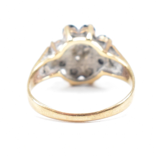 324 - A hallmarked 9ct gold sapphire and diamond cluster ring. The ring having one stone missing. Hallmark... 