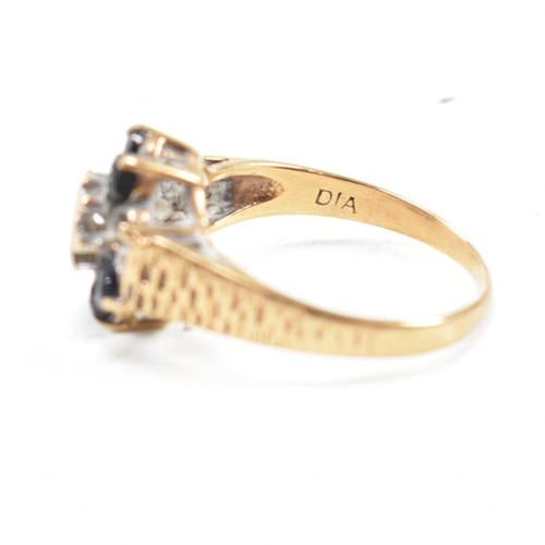 324 - A hallmarked 9ct gold sapphire and diamond cluster ring. The ring having one stone missing. Hallmark... 