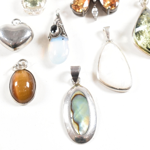 330 - A selection of gem set necklace pendants. The pendants to include butterfly heart abalone, mother of... 