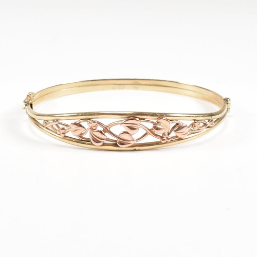 35 - A hallmarked 9ct gold Clogau 'Tree of life' bangle with floral mounted head. Total weight 5.4g. Meas... 