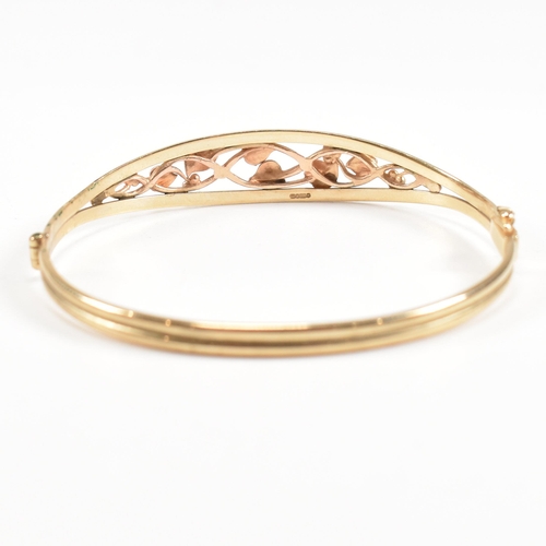 35 - A hallmarked 9ct gold Clogau 'Tree of life' bangle with floral mounted head. Total weight 5.4g. Meas... 