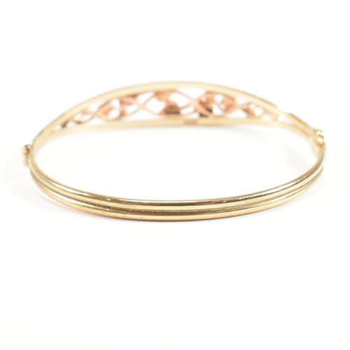 35 - A hallmarked 9ct gold Clogau 'Tree of life' bangle with floral mounted head. Total weight 5.4g. Meas... 