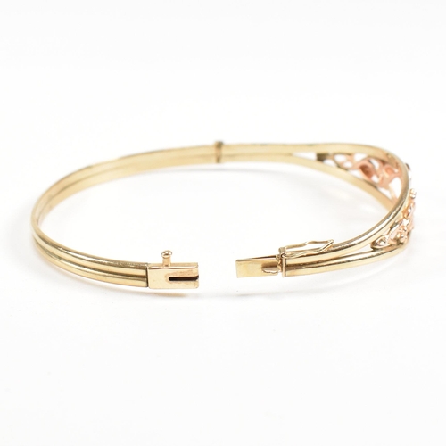 35 - A hallmarked 9ct gold Clogau 'Tree of life' bangle with floral mounted head. Total weight 5.4g. Meas... 