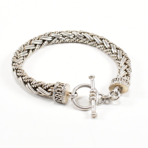 352 - A Byzantine silver style bracelet. The bracelet formed of a chunky plated chain with filigree finial... 