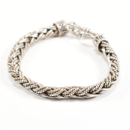 352 - A Byzantine silver style bracelet. The bracelet formed of a chunky plated chain with filigree finial... 