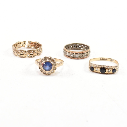 353 - Four hallmarked 9ct gold gem set rings. The rings to include a white stone eternity ring, a hallmark... 