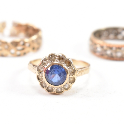 353 - Four hallmarked 9ct gold gem set rings. The rings to include a white stone eternity ring, a hallmark... 