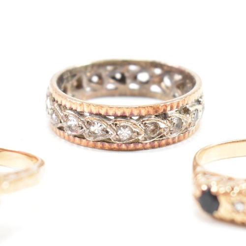 353 - Four hallmarked 9ct gold gem set rings. The rings to include a white stone eternity ring, a hallmark... 