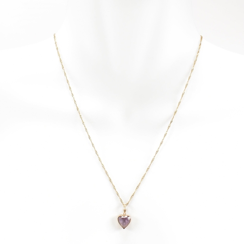 361 - A hallmarked 9ct gold pendant necklace. The necklace strung with an amethyst heart pendant on a fine... 