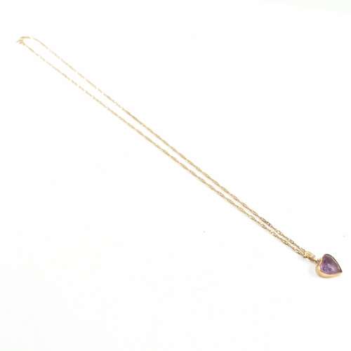 361 - A hallmarked 9ct gold pendant necklace. The necklace strung with an amethyst heart pendant on a fine... 