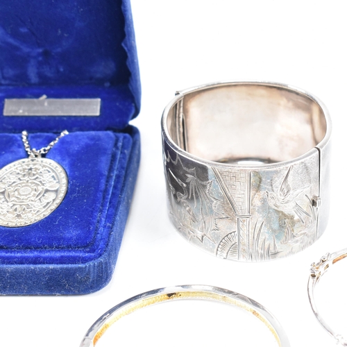 364 - A collection of silver jewellery. The jewellery to include a Victorian Sterling Silver hinged bangle... 