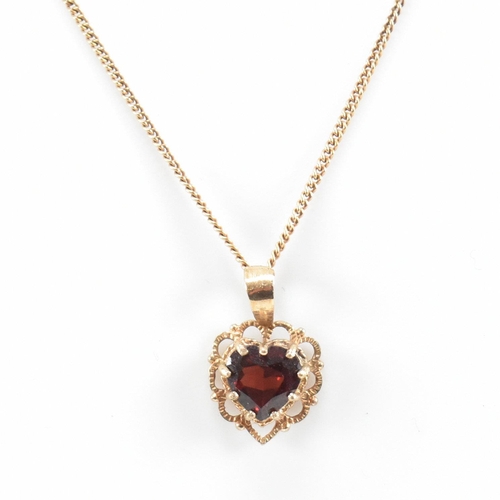 371 - A gold and garnet pendant necklace. The necklace strung with a  garnet set on a fine link chain. Cha... 