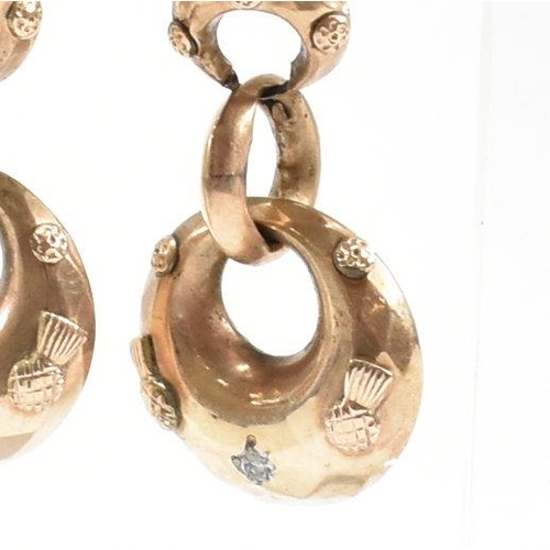 373 - A pair of 19th century pendant earrings. The earrings formed with three graduated hoops with partial... 