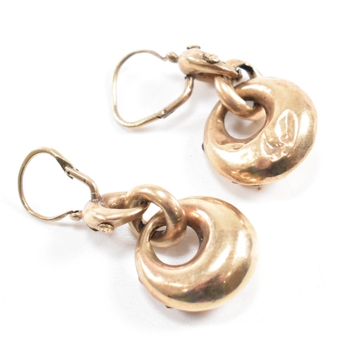 373 - A pair of 19th century pendant earrings. The earrings formed with three graduated hoops with partial... 