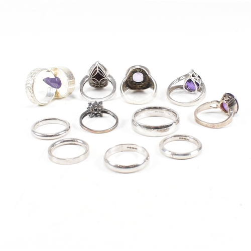 382 - A collection of 925 silver and gem set rings.The rings to include amethyst quartz, CZ, marcasite ban... 