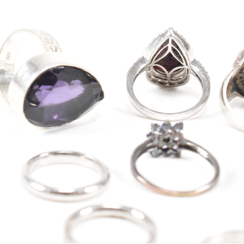 382 - A collection of 925 silver and gem set rings.The rings to include amethyst quartz, CZ, marcasite ban... 