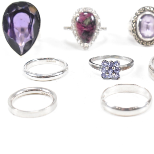 382 - A collection of 925 silver and gem set rings.The rings to include amethyst quartz, CZ, marcasite ban... 