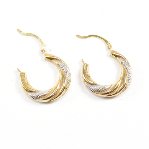 389 - Two pairs of 9ct gold earrings.  A pair of large twisted hoop earrings marked 375, 2.8cm. A pair of ... 