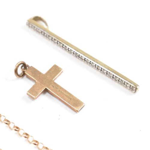 393 - A hallmarked 9ct gold chain and two pendants. The chain hallmarked 9ct rose gold. The pendants inclu... 