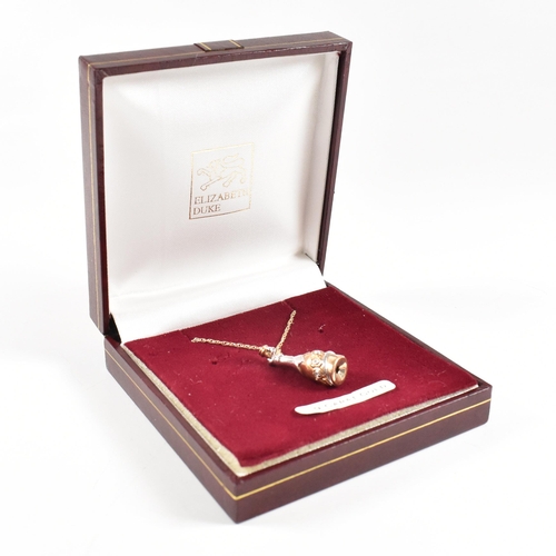 397 - A hallmarked 9ct gold and diamond millennium pendant necklace. The necklace strung with a diamond se... 